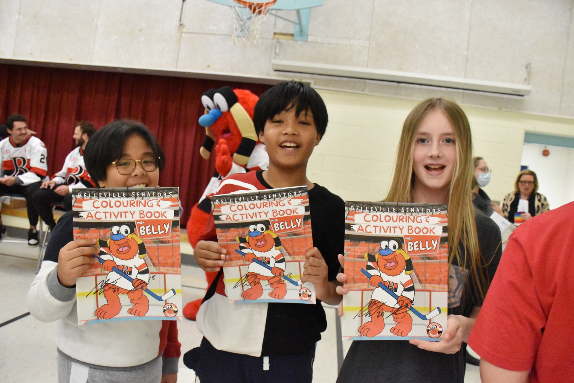 Students holding activity books