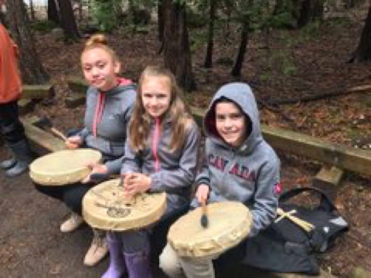 Students drumming.