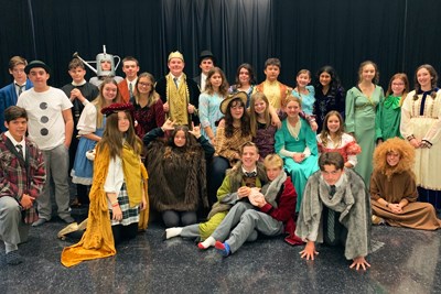 Drama class in ecclectic costumes pose for a photo.jpg
