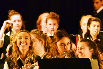 Holy Cross Instrumental Music students enjoy performing on the HC stage.jpg