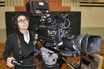 A Com Tech SHSM student operates a professional television camera.jpg