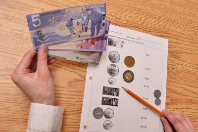 Life Skills Under 18 student learns to identify money.jpg