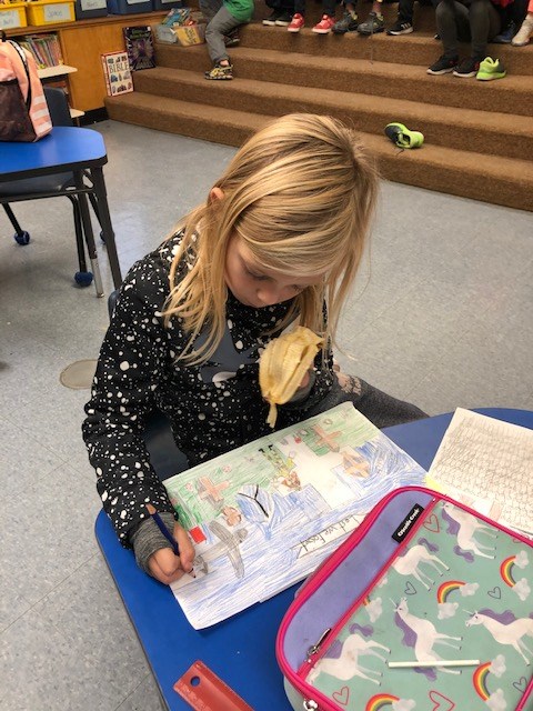Student colouring a picture.