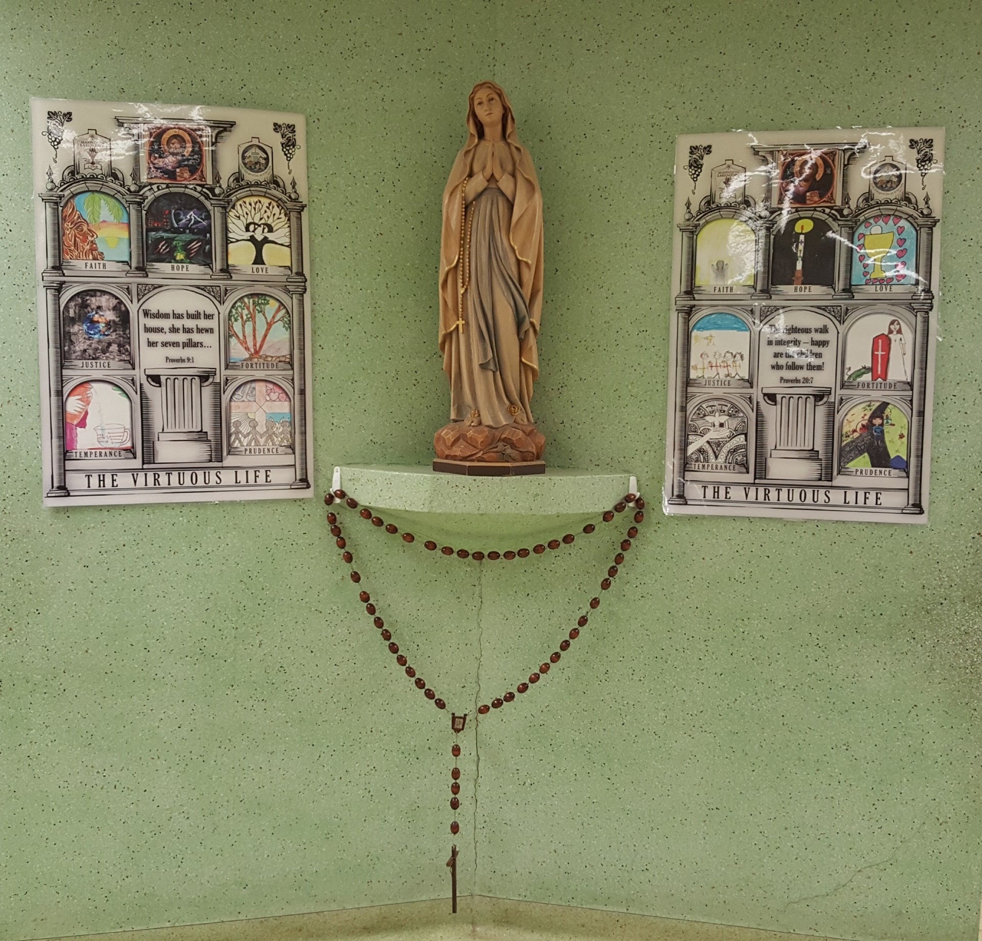 Statue of Mary with rosary