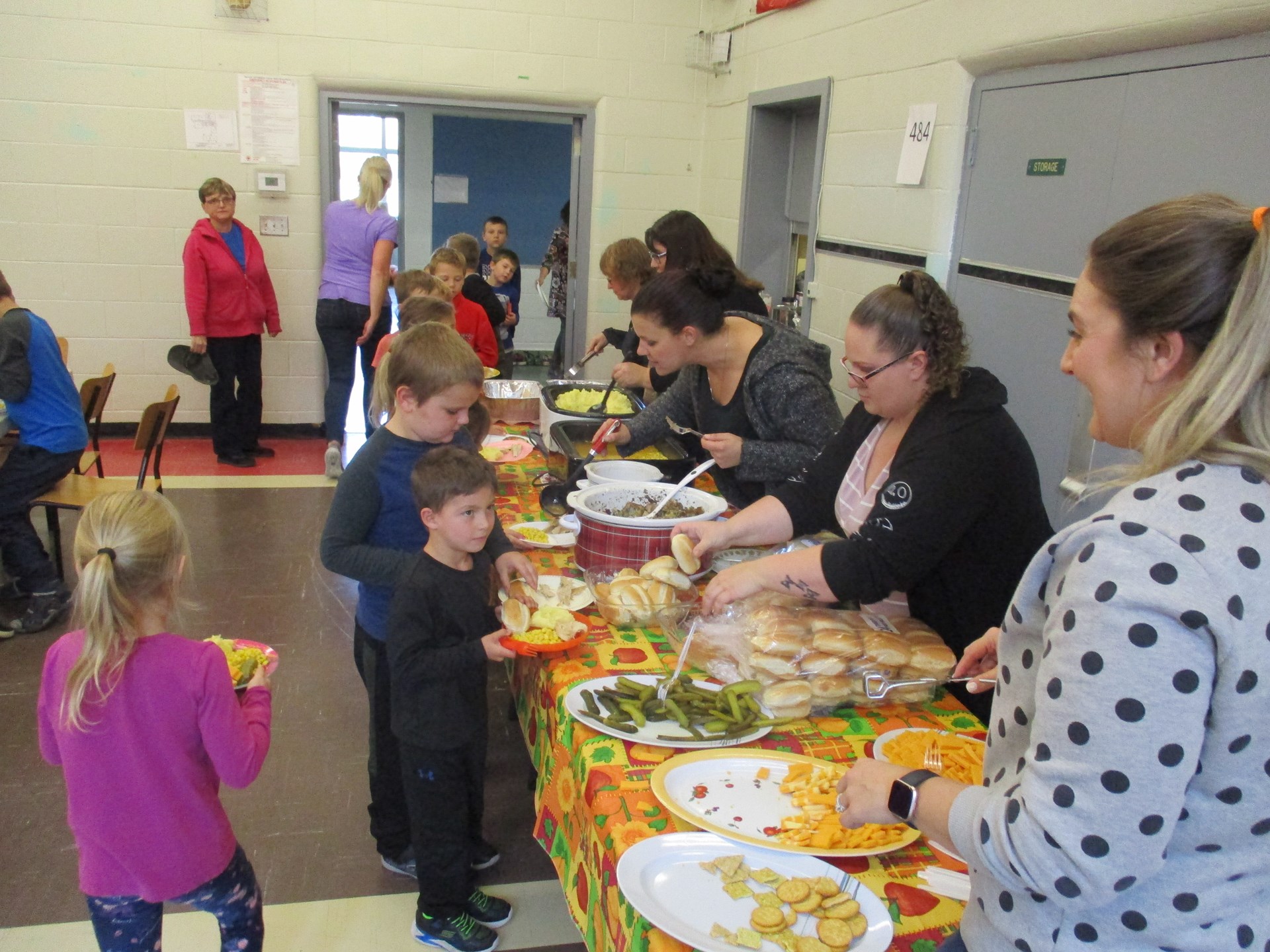 Parents helping serve a special lunch.