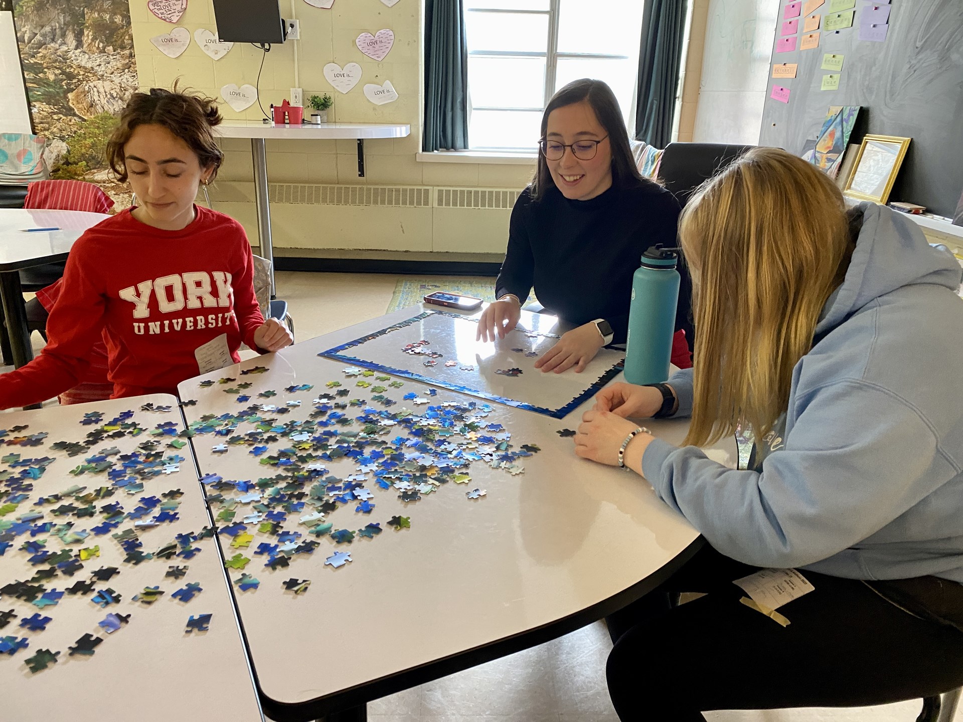 students working on a puzzle.