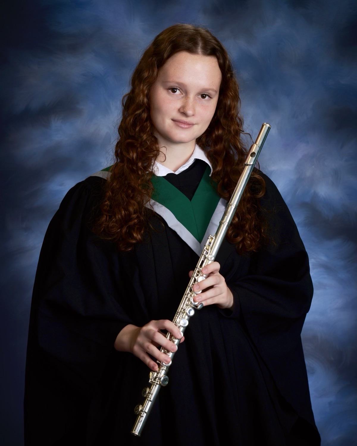 Katie Murphy holding a flute in her  HCCSS graduation photo.