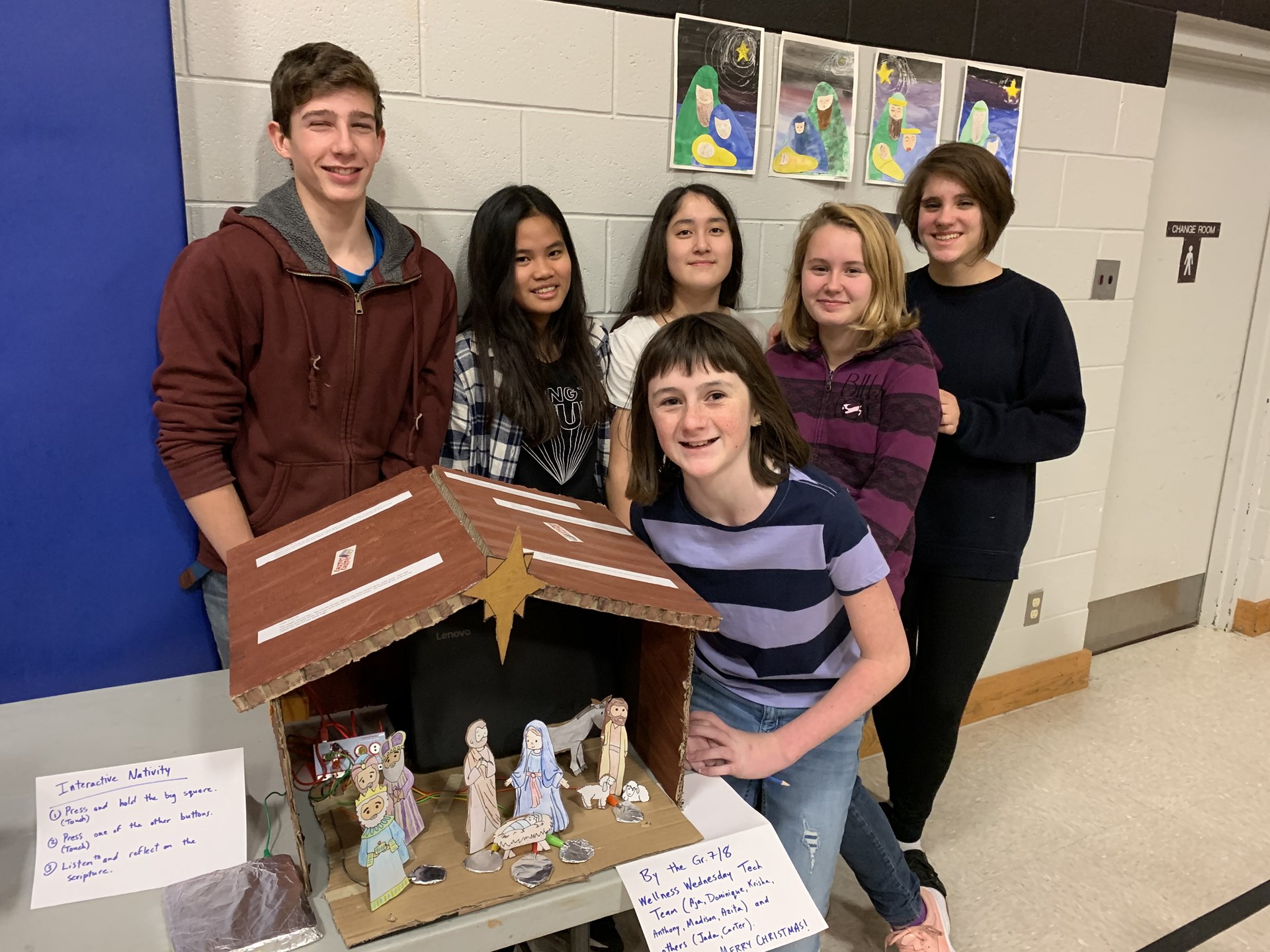 Students in front of their interactive Nativity scene.