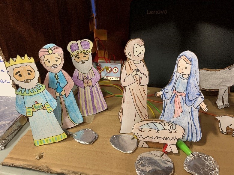 Mary and Joseph with the three Wise Men.