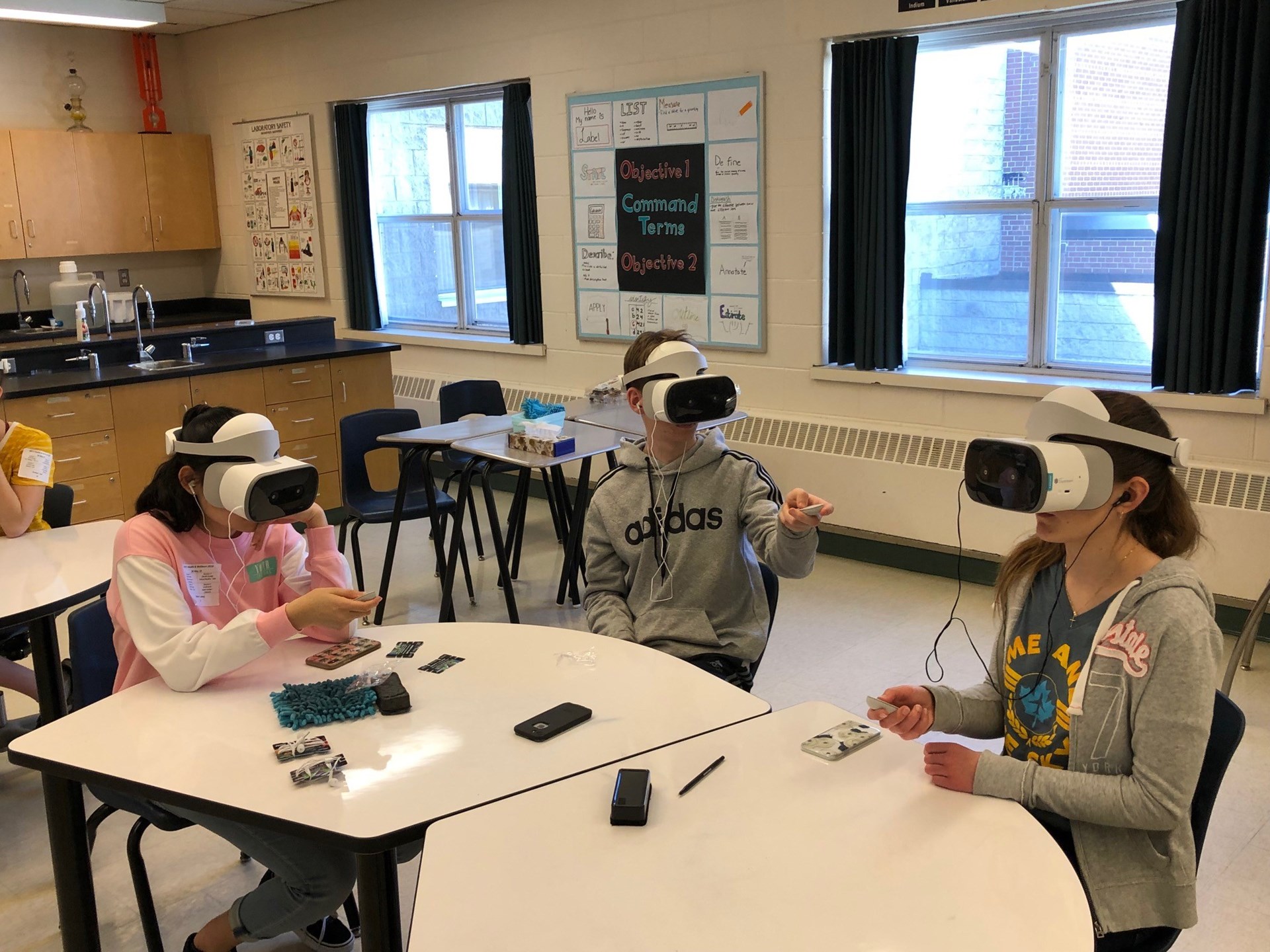 students playing with the virual reality technology