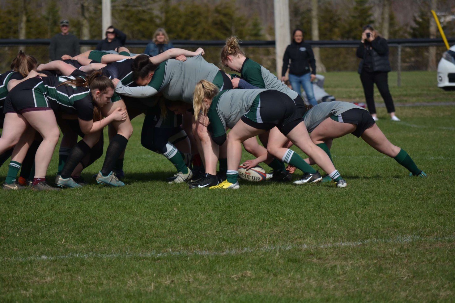 Rugby players tackling the ball
