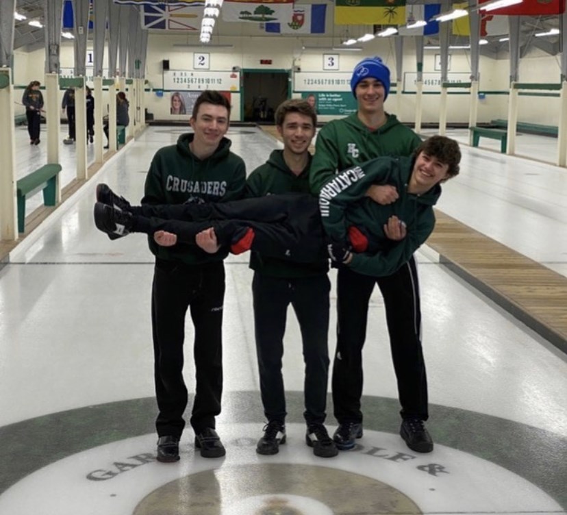 Curling team posing for photo
