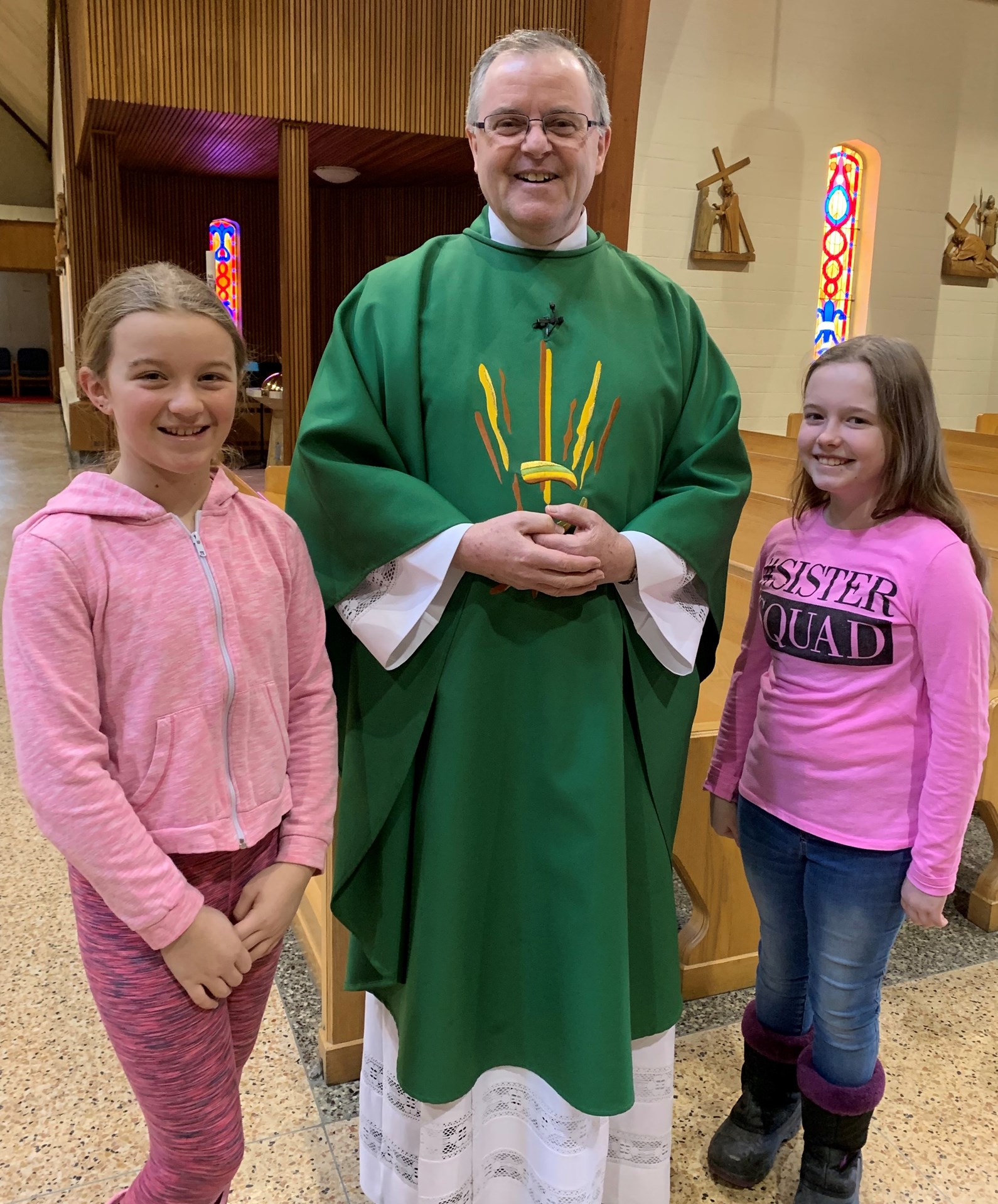 Father Charles with students